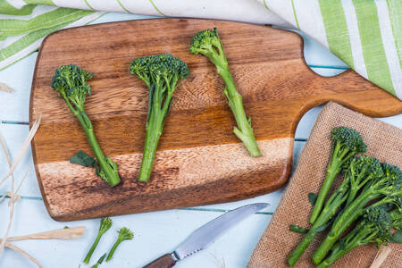 Broccolini on a wooden board