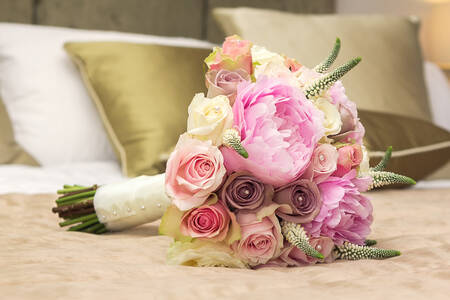 Bride's bouquet on the bed