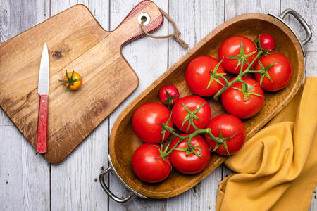 Wooden tray with tomatoes