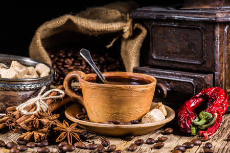 Šálka ​​kávy a korenia na stole