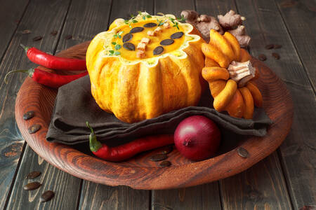 Pumpkin soup on a wooden tray