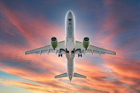 Airplane in the light of sunset