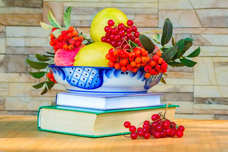 Apples and rowan berries on a platter