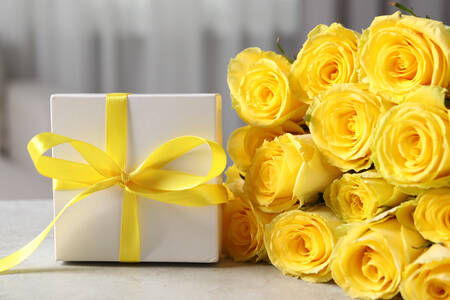 Yellow roses and a gift