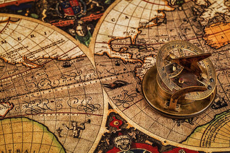 Old compass on the map of the ancient world
