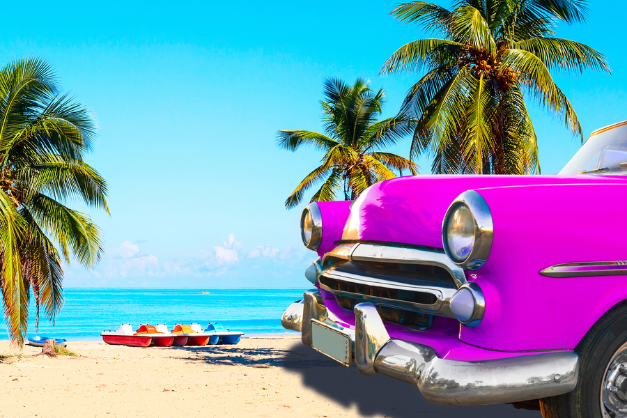 Colorful retro car by the sea