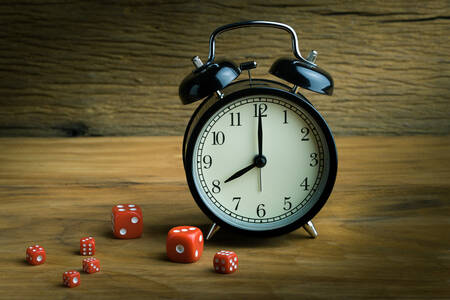 Alarm clock and red cubes