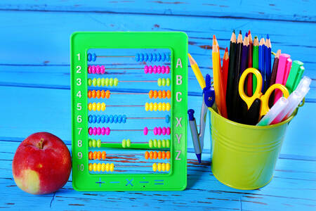 Multi-colored abacus and pencils