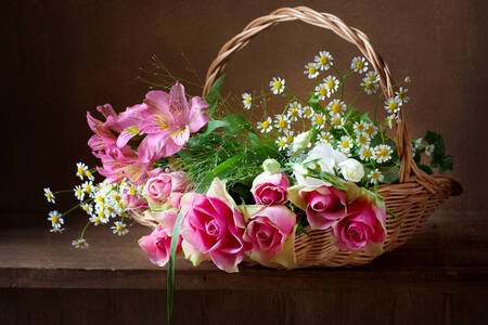 Bouquet in a basket on the table