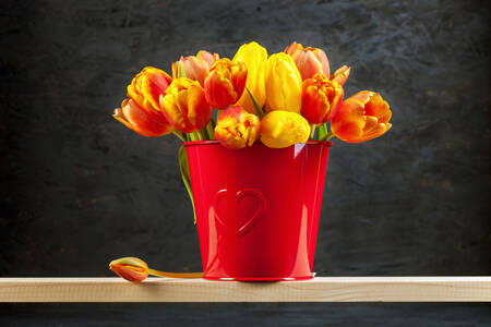 Tulips in a red bucket