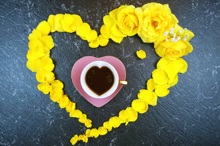 Cup in a heart of yellow roses