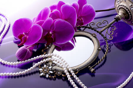 Orchids and pearls on a mirror