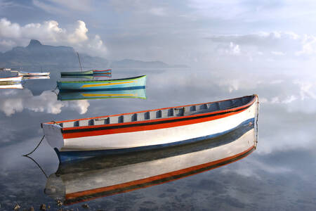 Boats on a foggy lake