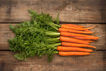 Carrots on wooden background