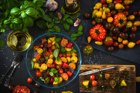 Multicolored tomatoes and basil