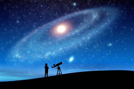 En astronom tittar på den stjärnklara himlen